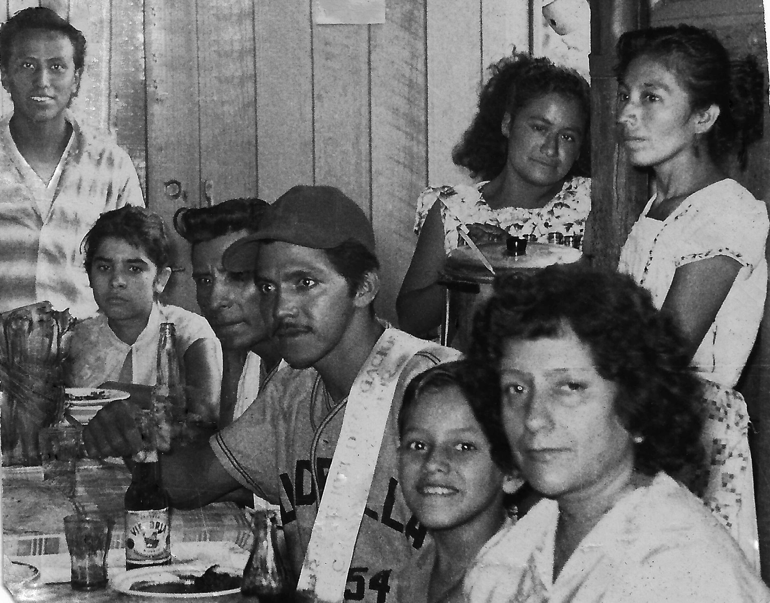 Festejando en familia, después de un merecido juego de béisbol, el peón de vía  Margarito López Martínez en la ranchería  Los Cocos, Mpio. de Tónala, Chiapas, 1959.